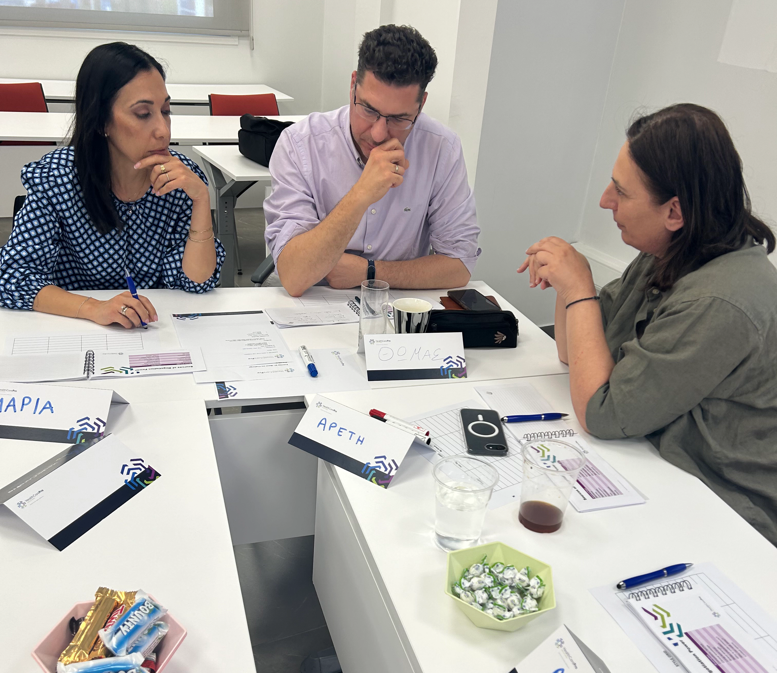 Small group discussion focused on problem-solving during healthcare professional development training.